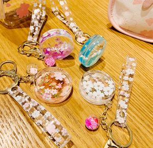 Joli porte-clés pendentif en forme de cœur avec fleur de cerisier, bouteille d'huile, accessoires pour sac, porte-clés de voiture, pendentif liquide Kawaii, cadeau - Product Image 2