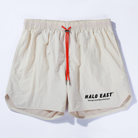 Vente en gros de shorts d'été personnalisés avec logo pour la course à pied 100% polyester double couche de 5 pouces pour hommes
