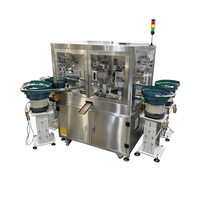 Ligne de production automatique de remplissage et de bouchage de flacons de petite taille en forme de boule pour huiles essentielles