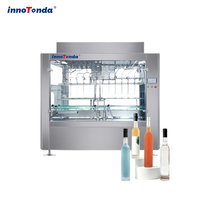 Ensemble complet de remplisseuse linéaire automatique à gravité à prix abordable pour les petites et moyennes usines de production de liquides