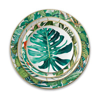Service de table de luxe en or véritable motif feuille tropicale, assiette de présentation en céramique jungle en porcelaine fine, tasse à café et bol en porcelaine pour événements hôteliers