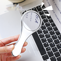 Miroir de maquillage de bureau minimaliste, pliable, portable, design rond compact avec cadre en plastique, poignée confortable, adapté aux étudiants