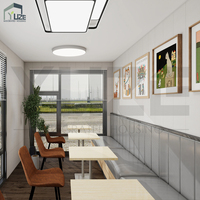 Conteneur de restaurant de luxe personnalisable de 20 pieds ou 40 pieds, à 2 étages, entièrement équipé, avec terrasse et escalier