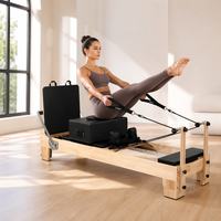 Reformer Pilates en chêne en gros avec système de cordes réglables pour la distribution de Reformers Pilates