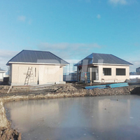 Villa préfabriquée en acier léger à 2 chambres, durable, écologique, anti-corrosion, étanche, alimentée à l'énergie solaire, avec carport