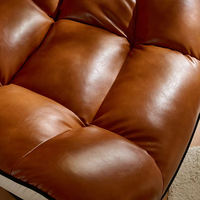 Chaise longue de loisirs moderne rétro marron, confortable, élégante et polyvalente, en cuir, pivotante pour la maison
