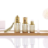 Vente en gros de flacons de parfum à l'huile d'attar arabe fantaisie dorée octogonale fine de 3 ml, 6 ml, 12 ml avec bille roulante et bâtonnet