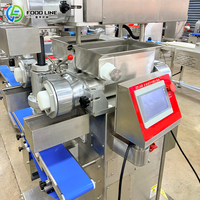 Machine à encruster à vitesse réglable pour la préparation de pâtisseries fourrées de différents types
