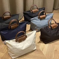 Sac de voyage décontracté personnalisable avec poignée, en nylon imperméable, couleur unie, sac bouffant grande capacité, bagage à bandoulière