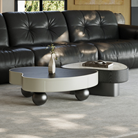 Ensemble de tables basses gigognes modernes avec plateau en pierre frittée travertin, table d'appoint en placage de bois noir avec tiroir