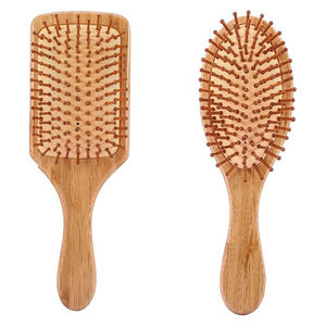 Brosse démêlante LOGO en poils naturels et bambou, avec coussin et peigne de massage pour le cuir chevelu - Product Image 1