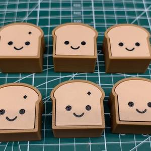 Juguete Antiestrés QY PLA con Forma de Pan Tostado de Dibujos Animados, con Teclado y Vibración Eléctrica - Product Image 1