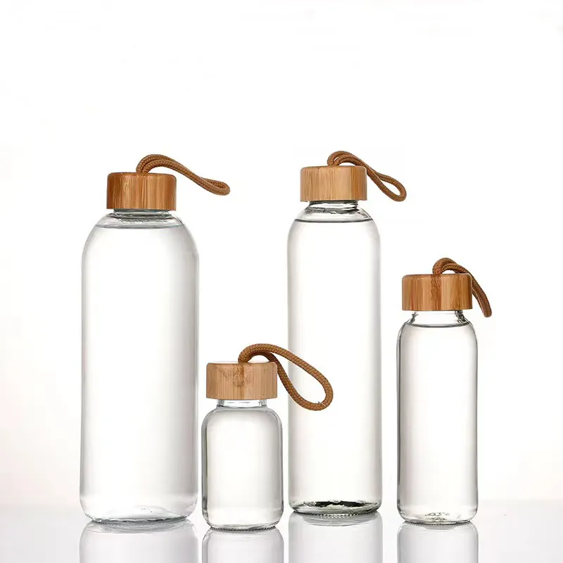 زجاجة مياه 500 مل من زجاج البورسليكات مستدير وشفاف عالي الجودة بعلامة تجارية مخصصة