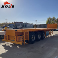 Elegante naranja profesional mejor tecnología de producción nuevo remolque completo de transporte de cama plana pesada con placa deflectora