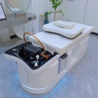 Lit de lavage capillaire haut de gamme en fibre de verre avec fonction de massage par circulation d'eau et design thaïlandais pour salons de coiffure