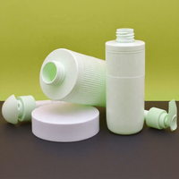 Bouteille distributrice vide en plastique vert pastel clair avec deux types de pompe à pression, bouteille de lotion PET à rayures verticales avec pompe