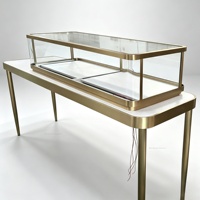 Vitrine de présentation de bijoux rectangulaire de luxe, cadre en métal fin doré, comptoir à bijoux en verre trempé avec éclairage LED, métal élancé