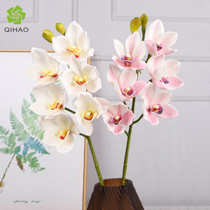 Qihao - Orquídea Cymbidium Artificial de Silicona con 6 Cabezas, Tacto Natural, Decoración para Mesa de Comedor, 67 cm de Largo - Product Image 1