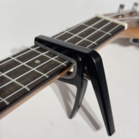 Capo durable de qualité supérieure Accessoires professionnels pour instruments de musique Capo pour ukulélé en gros OEM Fabriqué en Chine