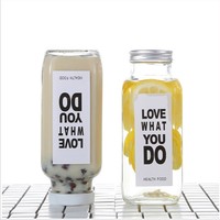 Vente en gros de bouteilles en verre transparentes cylindriques mates de 12 oz, neuves, pour jus et eau, avec couvercle, écologiques et recyclables