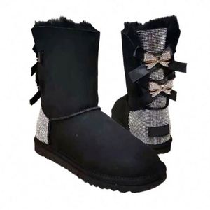 Logo personnalisé en usine bottes <span class=keywords><strong>de</strong></span> <span class=keywords><strong>neige</strong></span> chaudes en peau <span class=keywords><strong>de</strong></span> mouton antidérapantes pour l'hiver avec nœud papillon pour femmes bottes <span class=keywords><strong>de</strong></span> luxe en fourrure avec nœuds - Product Image 1