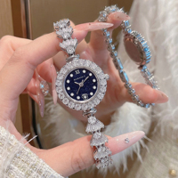 Nouvelle montre-bracelet de luxe pour femme, cadran en nacre, lunette entièrement pavée de strass, montre-bracelet à quartz pour femme, idéale comme cadeau de mariage