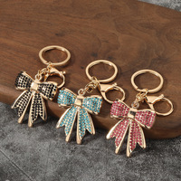 Porte-clés tendance en métal avec nœud papillon et strass, pendentif de sac, cadeau promotionnel en gros