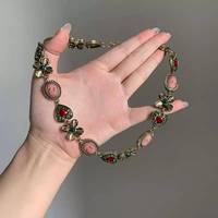 Collier ras du cou vintage XM N453 avec pendentif cœur rouge en strass et fleur verte, chaîne maillée, style rétro gothique pour femme, bijou de cou quotidien
