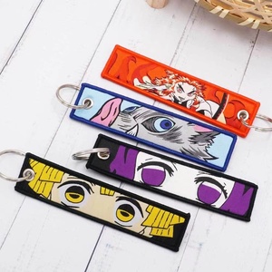 54 Design High Quality Embroidered Mixed Anime Flight Tag Keychain for Backpack Bag Decoration - Product Image 1