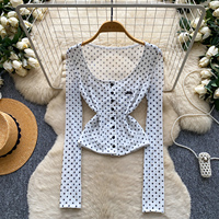 Chemisier d'été à pois pour femme, coupe ajustée, manches longues, boutonné, style peplum, idéal pour le bureau