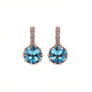 Eleganti orecchini pendenti placcati oro rosa con zirconi blu incastonati a griffe per donna, gioielli alla moda per feste, stile classico - Product Image 1