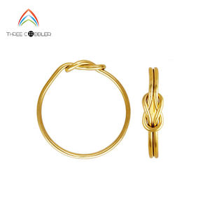 Anillo de boda de oro de 14 quilates con doble nudo, joyería minimalista de alta calidad - Product Image 1