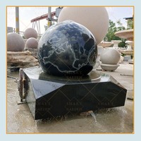 Grande fontaine de jardin en marbre, sphère rotative en granit noir, fontaine à eau