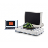 Apparatuur voor het analyseren van de kleur van fruit- en meloenvlees in dwarsdoorsneden, voor het analyseren van dwarsdoorsneden van watermeloenen en Hami-meloenen.
