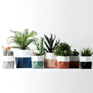 Redeco 2023 Novelty Ceramic Flower Pots Wholesale Simulation Kraft Paper Bag Design With Drainage Ceramic Planter For Garden Sup