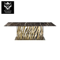 Table à manger élégante de luxe 6 places avec dessus en marbre et socle évidé en acier inoxydable meubles de salle à manger