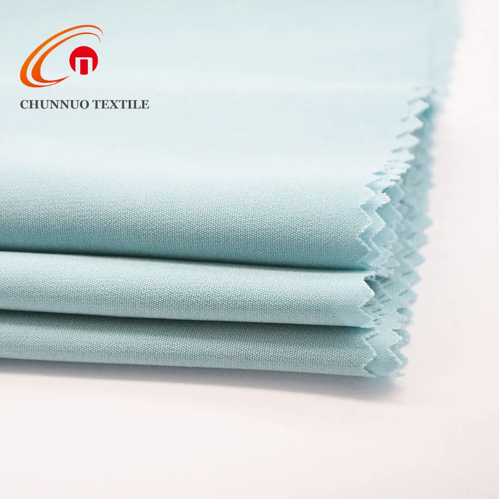 Shaoxing tekstili % 100% Polyester % 100% Polyester yün şeftali kumaş arap dokuma düz boyalı 1500m renkli CHUNNUO makyaj sipariş üzerine