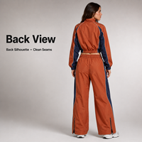 Ensemble coupe-vent en gros avec pantalon large contrastant orange et bleu marine à fermeture éclair, faible MOQ, ensemble coupe-vent court