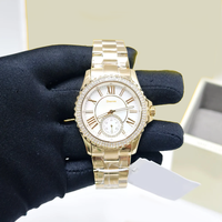 Montre de luxe pour femme MKOriginals en nacre, avec lunette en cristal festonné, sous-cadran, boîtier serti de diamants, étanche, chronographe doré