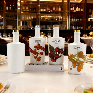 Botella de Vidrio de Lujo para Vino y Licor 750 ml Redonda Vacía Blanca para Licores, Ginebra, Whisky, Vodka, Tequila con Tapa de Corcho - Product Image 1