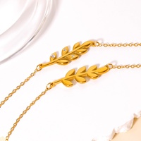 Ensemble collier et bracelet avec pendentif feuille en zircon plaqué or 18 carats en acier inoxydable