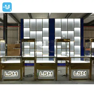 Trendy Custom Jewellery Display Cabinet Gold Stainless Steel Led Lighting Lockable Glass Jewelry Showcase Display Cabinet