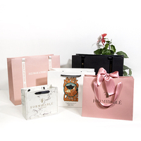 Vente en gros Sac fourre-tout de luxe avec nœud papillon Emballage en papier kraft avec logo personnalisé pour bijoux, cosmétiques, vêtements, cadeaux et bougies