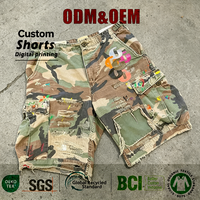 Shorts cargo camouflage personnalisés avec logo OEM, en tissu sergé de coton, patchwork vieilli et éclaboussures de peinture, style streetwear ample