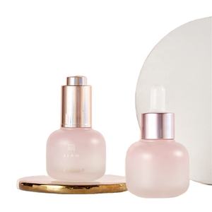 Belle bouteille en verre d'emballage cosmétique de soins de la peau rose avec pompe goutte à goutte automatique pour les cheveux <span class=keywords><strong>parfum</strong></span> essence yeux réparation sérum lotion crème - Product Image 1