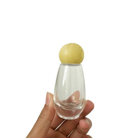Stock du fabricant Vente en gros Bouteille transparente en verre à tête de pompe à bouche de canard avec compte-gouttes pour lotion de presse de 30ml