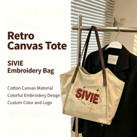 Sac fourre-tout en toile brodée avec poignée en cuir PU, grande capacité, sac à bandoulière, logo brodé personnalisé, motif pour la vente en gros
