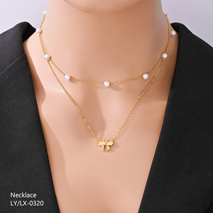 Collier pendentif nœud papillon double couche en acier inoxydable plaqué or 18 carats avec perles, inaltérable, pour femme, tendance et de luxe, le plus vendu - Product Image 1