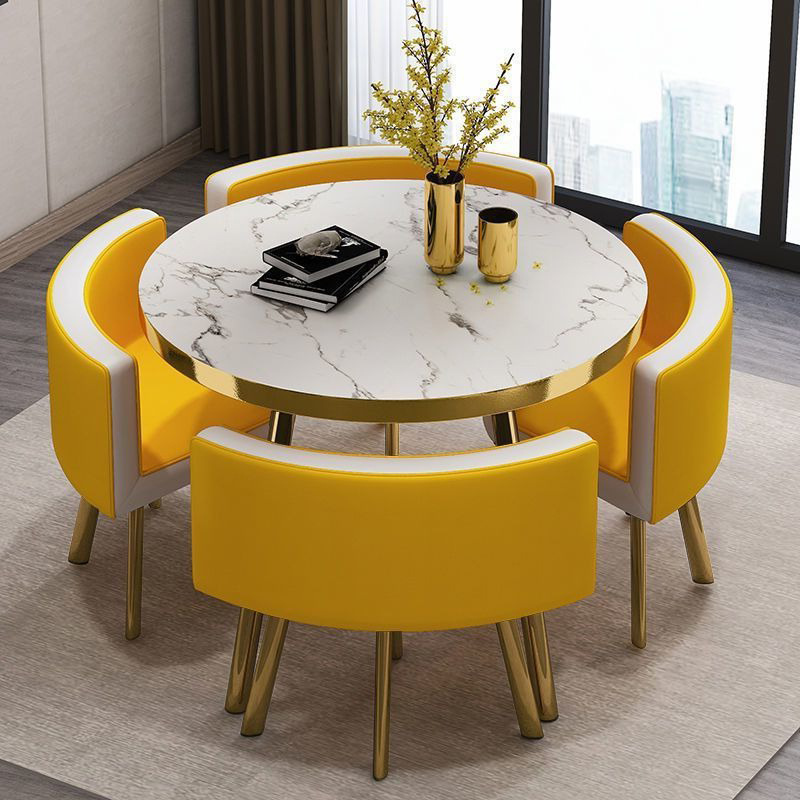 Mesa de piedra de imitación 4 sillas curvadas de cuero blanco y amarillo