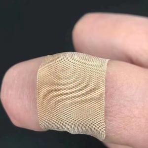 Adhesivo Elástico para Heridas Huachen, Color Piel, 100 Piezas/Caja, Adhesivo para Heridas de Uso Médico y Doméstico - Product Image 3